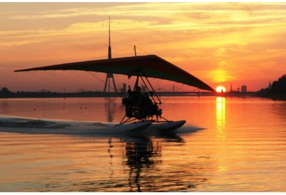 Hang gliding from water or land