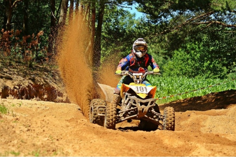Thrilling ride on quad bike in forest