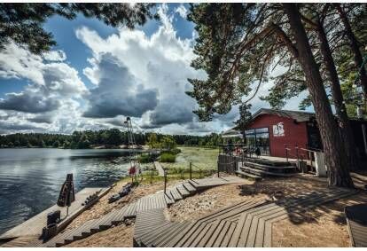 Overnight stay in a Bungalow cabin and SUP board adventure in Liepāja